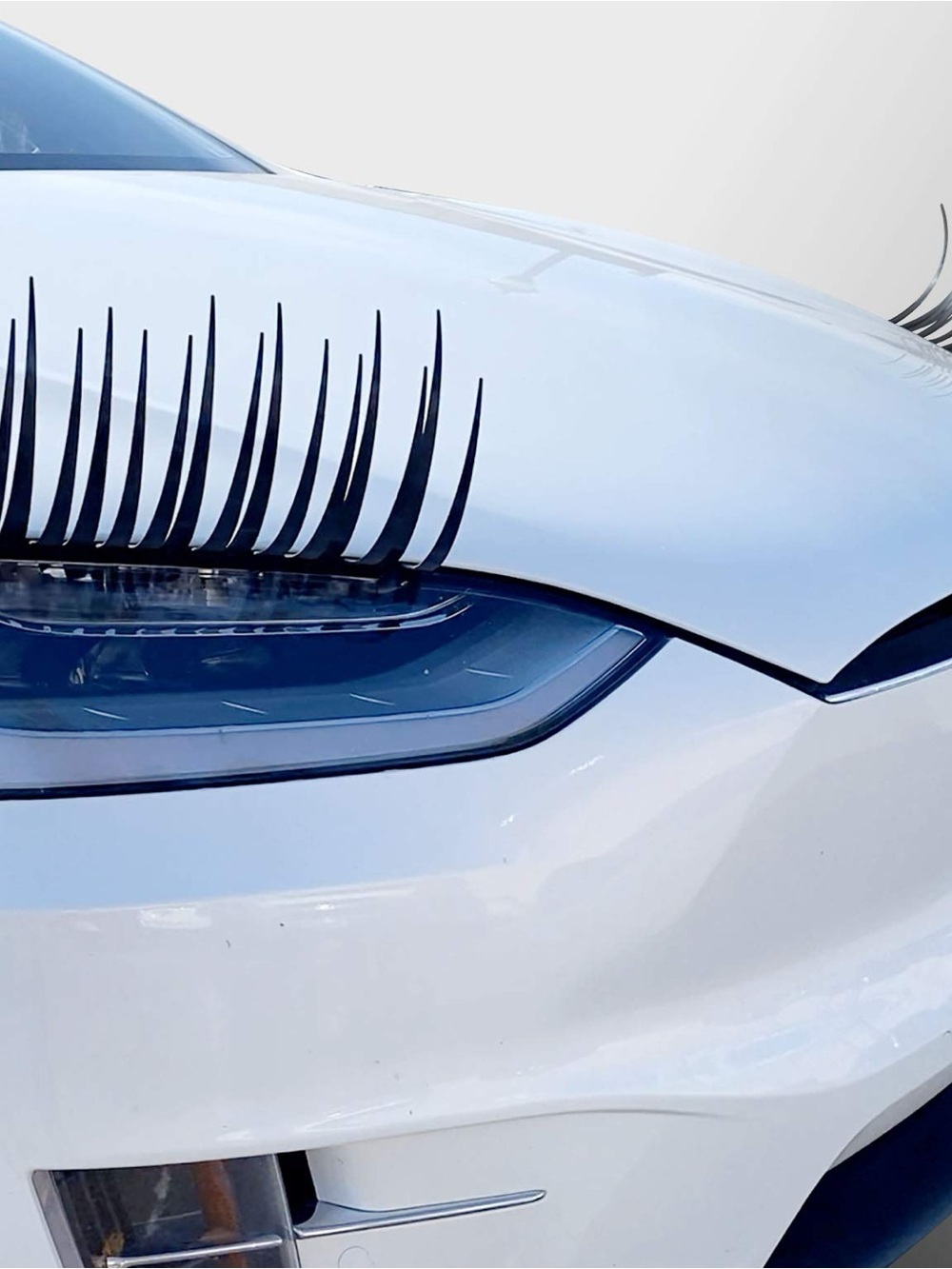 Black Eyelash Headlight Decals on White Car